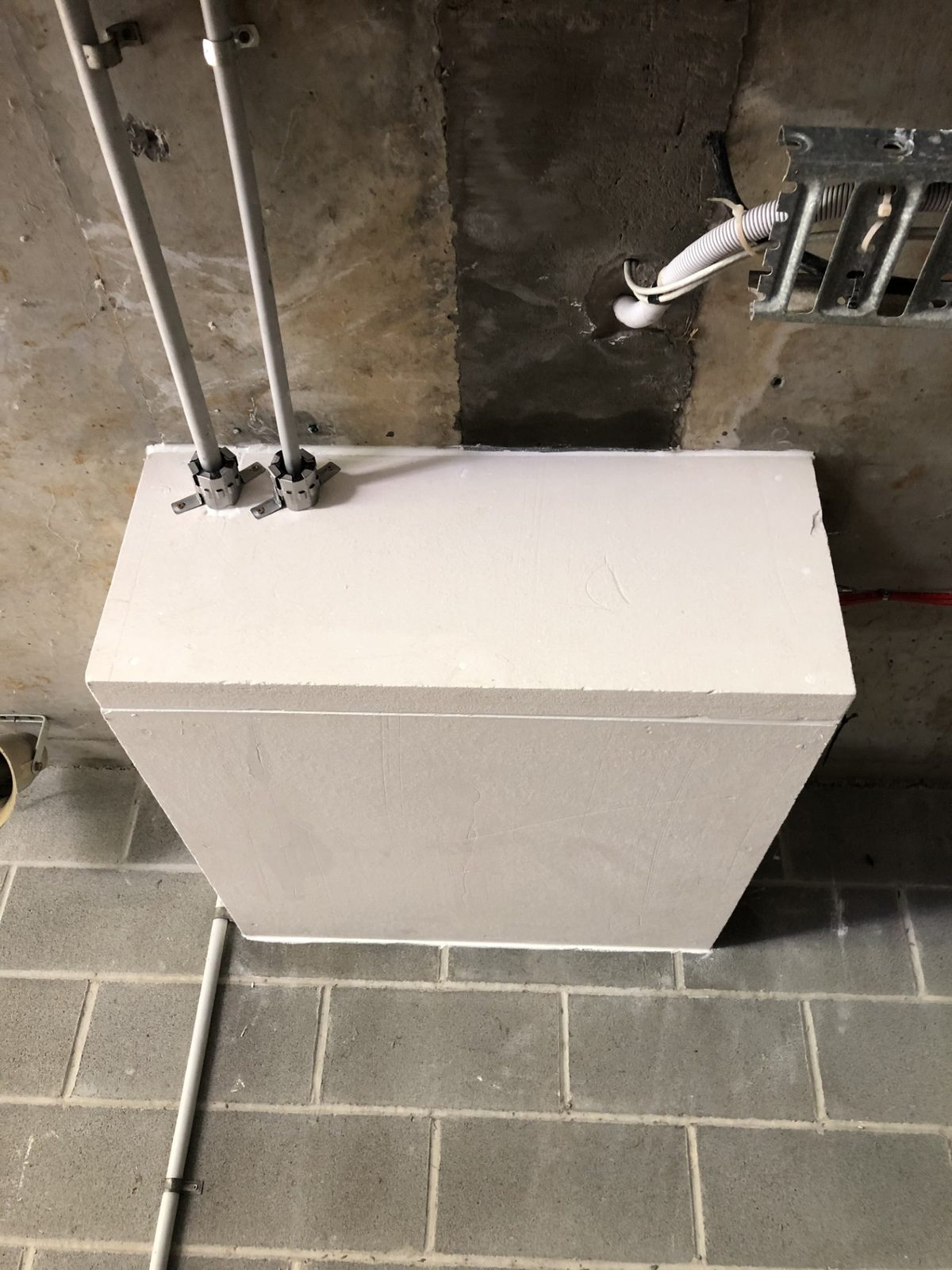 Fire-rated plasterboard shaft box-out forming a protected riser in a Sydney commercial building